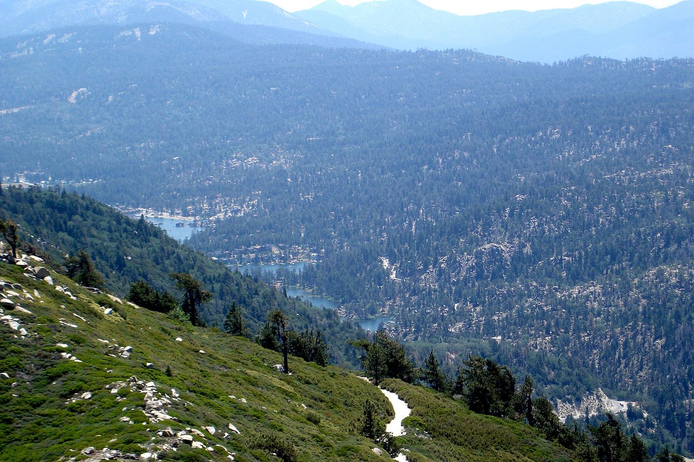 Big Bear Valley and the lake seen from a forested ridge in the San Bernardino Mountains